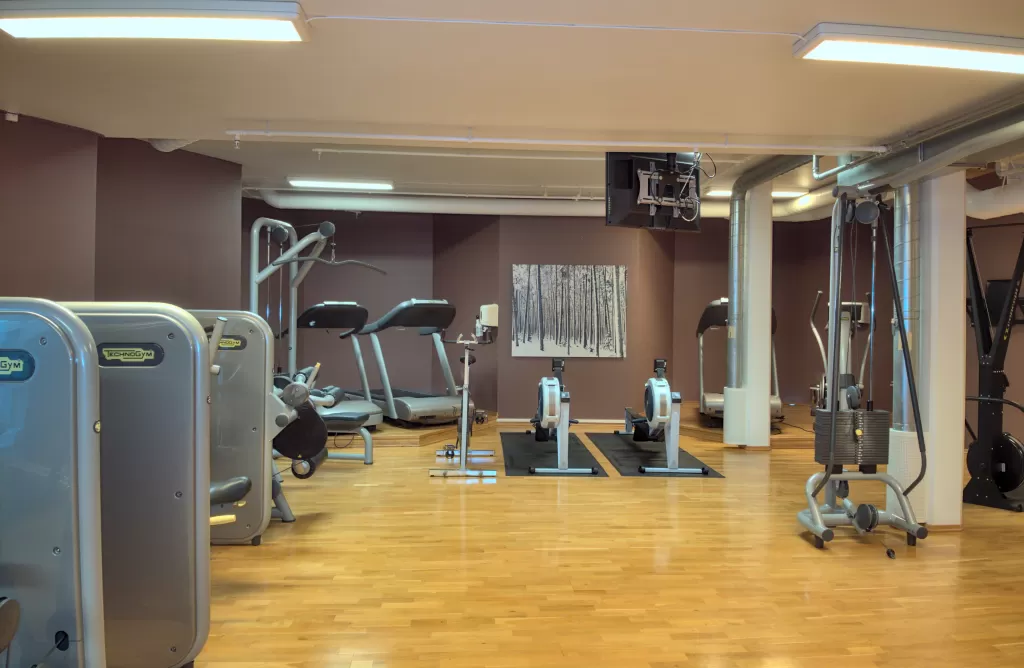 Fully equipped training room with running and rowing machines 