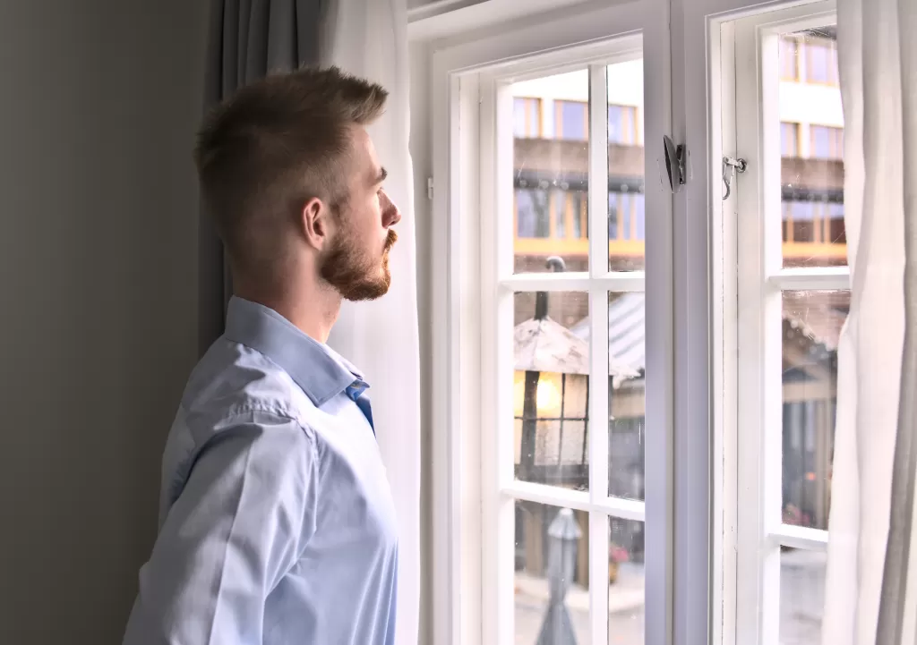 Watching through the room windows with fine and elegant curtains